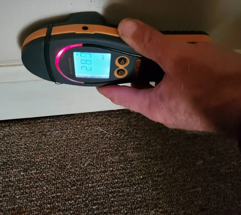 Moisture detection at baseboard during Storm Damage Restoration in North Branford